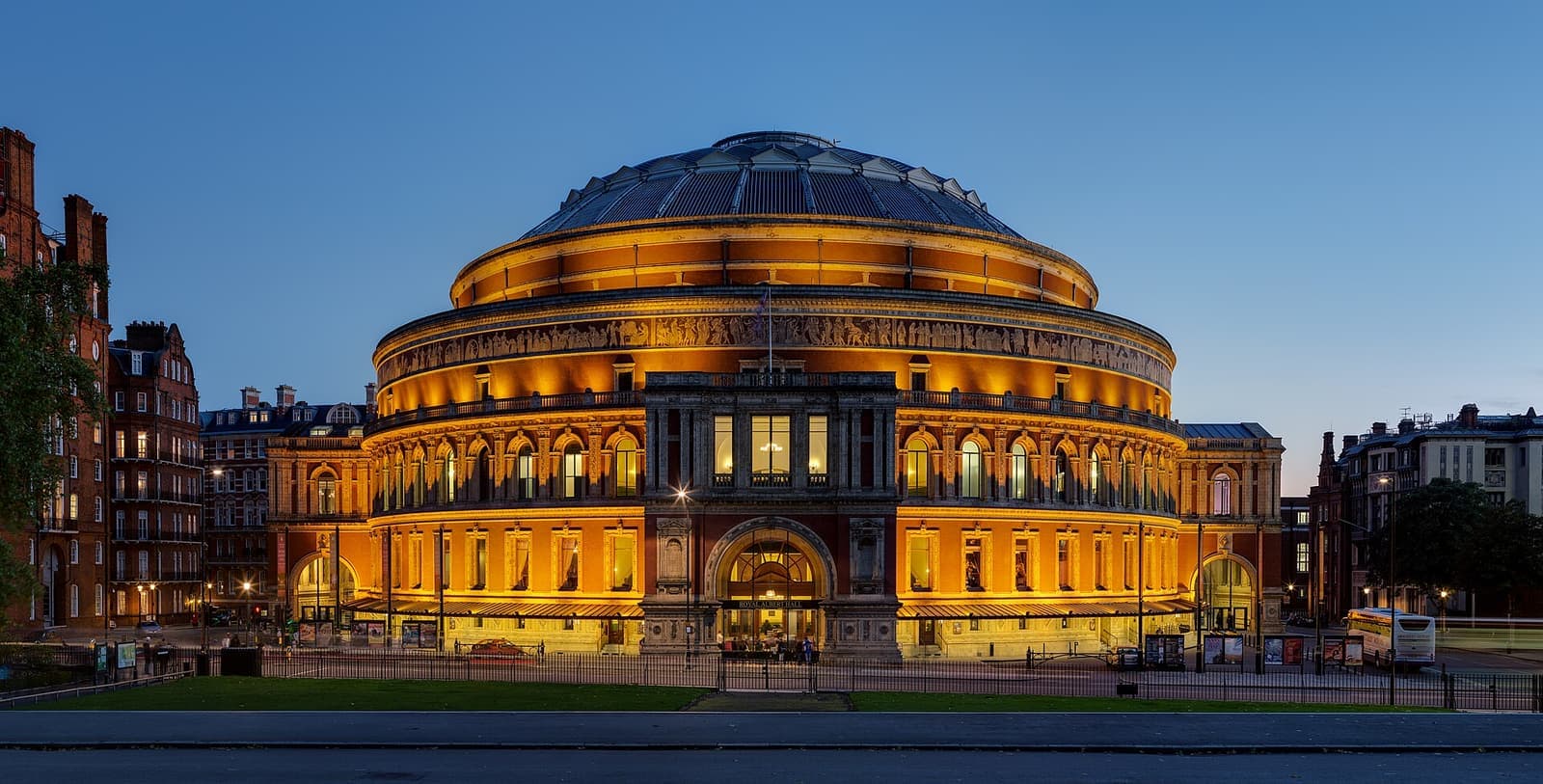 The Royal Albert Hall lit gold at dusk